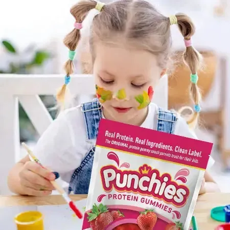 Kid friendly protein gummy: a girl painting with a bag of Punchies protein gummies